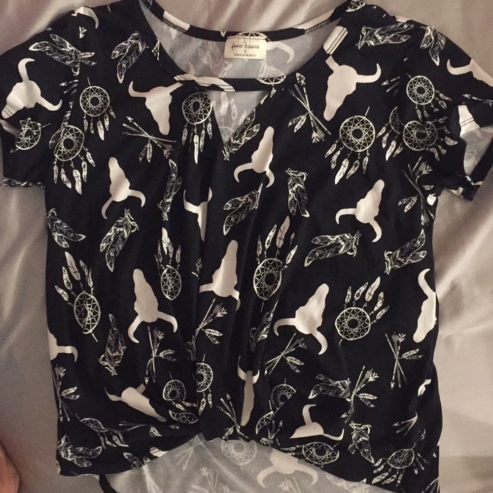 I am selling a black and white steerhead blouse.